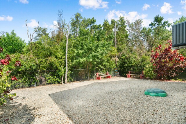 view of jungle gym featuring fence