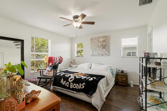 bedroom featuring dark wood-style flooring and ceiling fan