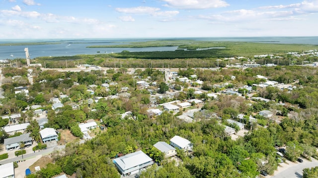aerial view of property's location featuring a nearby body of water