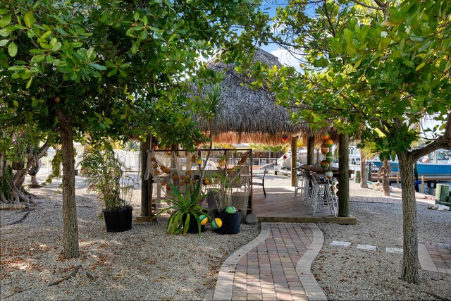 view of property's community featuring a deck and a gazebo