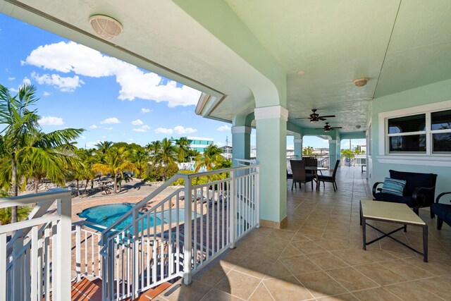 balcony featuring a patio and ceiling fan