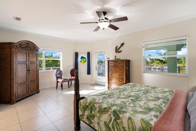 tiled bedroom featuring ornamental molding and ceiling fan