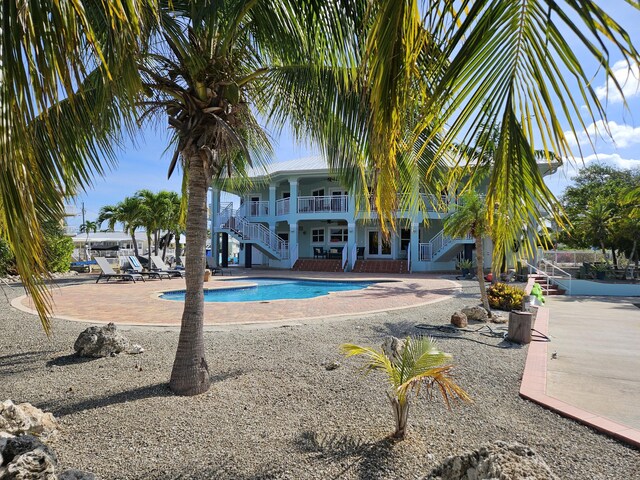 view of swimming pool featuring a patio