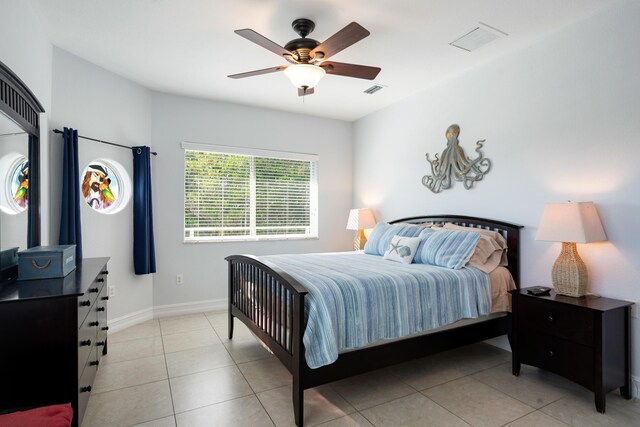 tiled bedroom with ceiling fan