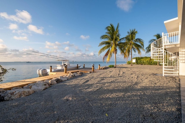 exterior space featuring a water view and a dock