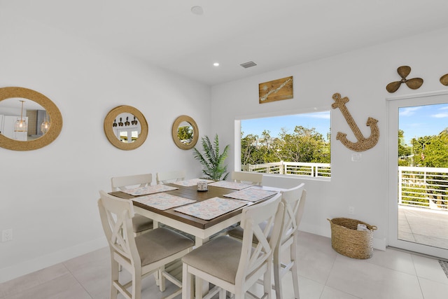 dining area featuring light tile patterned floors