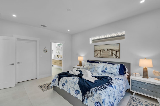 tiled bedroom with connected bathroom