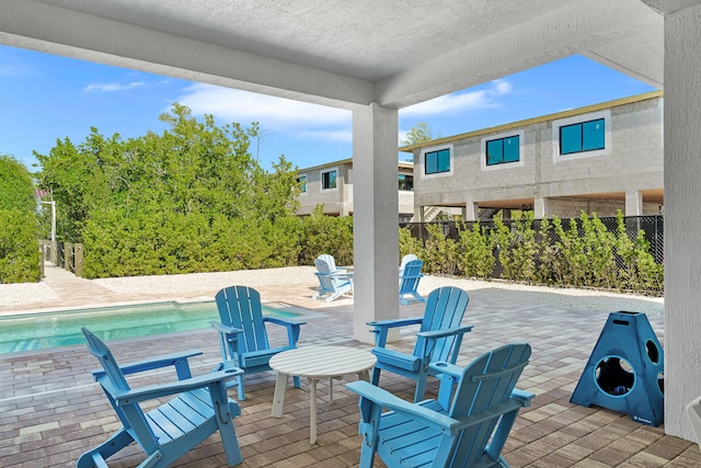 view of patio featuring a fenced in pool