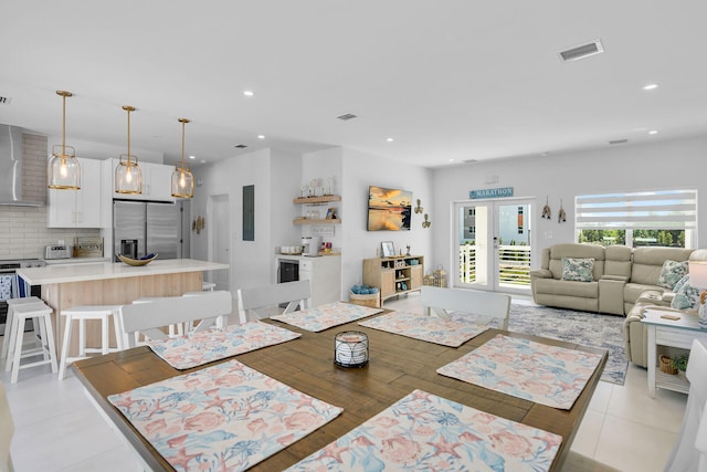 tiled dining room with french doors