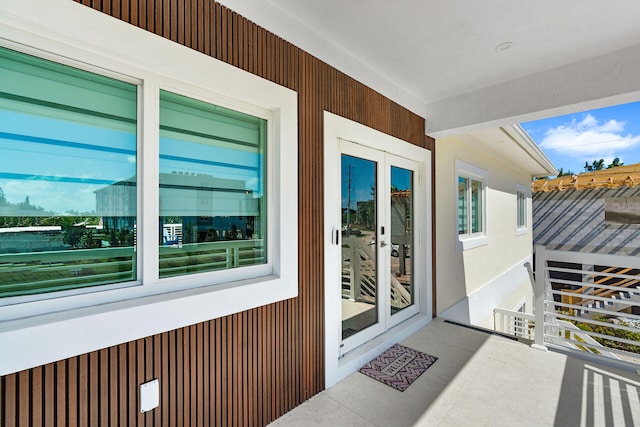 doorway to property featuring french doors and a balcony