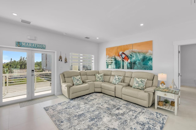 tiled living room featuring french doors and plenty of natural light