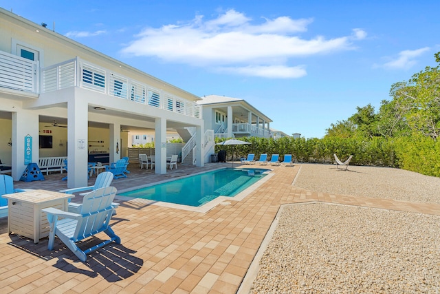 view of pool featuring ceiling fan and a patio