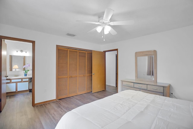 bedroom with ceiling fan, a closet, and light wood-type flooring