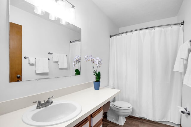 bathroom with vanity, a shower with curtain, wood-type flooring, and toilet