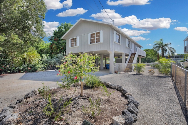 view of side of home featuring a carport