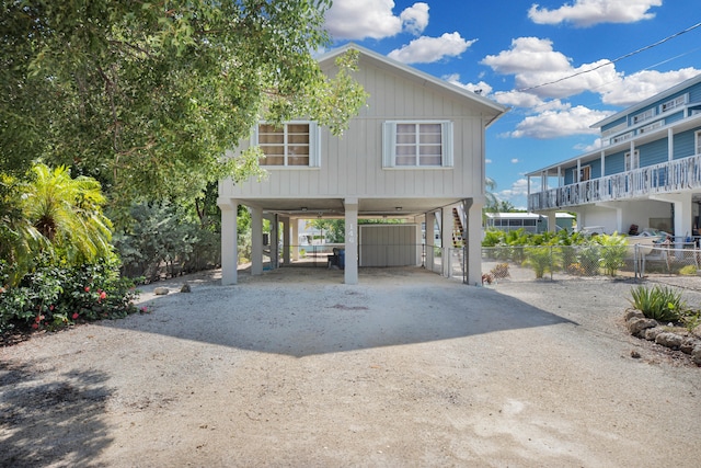 view of side of home featuring a carport