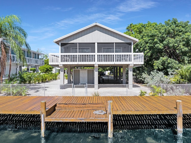 back of property with a sunroom and a patio