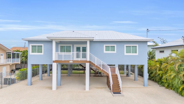 rear view of property with a carport
