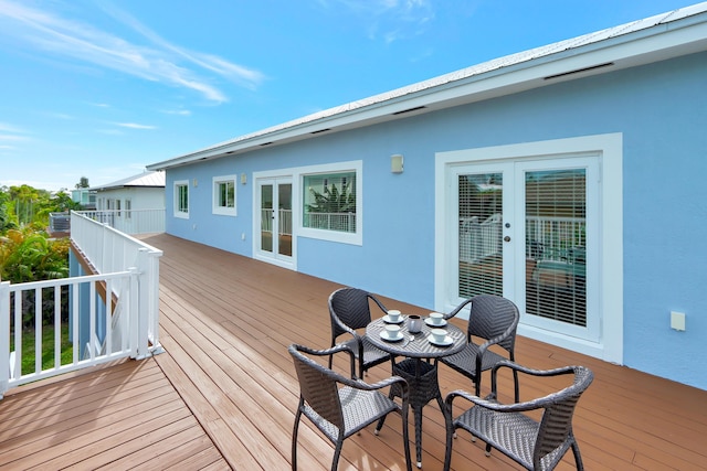 wooden terrace featuring french doors