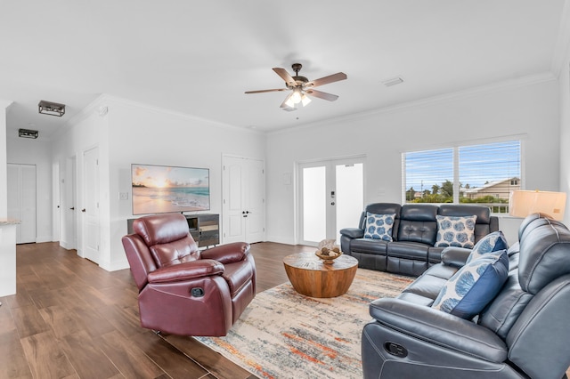 living room featuring ornamental molding, ceiling fan, dark hardwood / wood-style flooring, and french doors