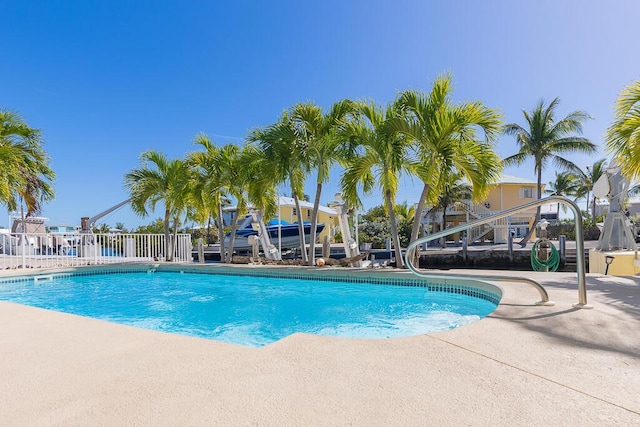 view of swimming pool with a patio area