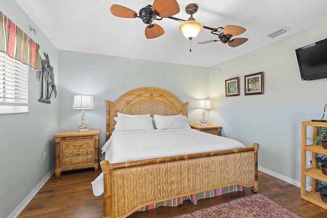 bedroom featuring dark wood-type flooring and ceiling fan