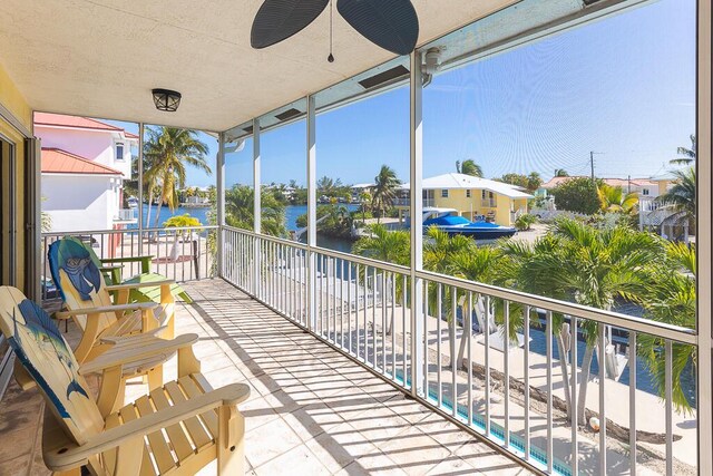 balcony featuring a water view