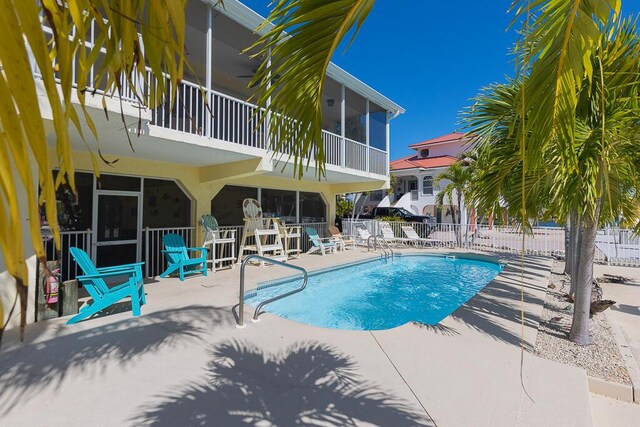 view of swimming pool with a patio area