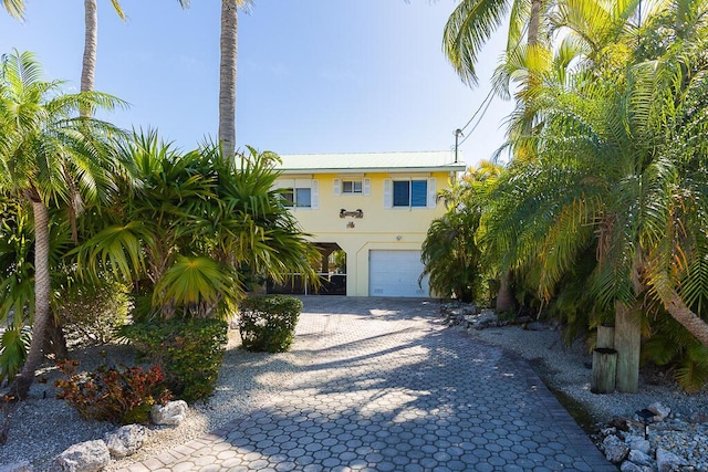 view of front of home with a garage