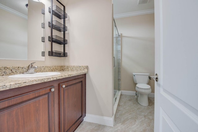 bathroom featuring crown molding, vanity, toilet, and a shower with door