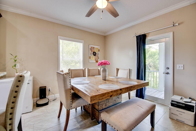 tiled dining area featuring ceiling fan, ornamental molding, and a wealth of natural light