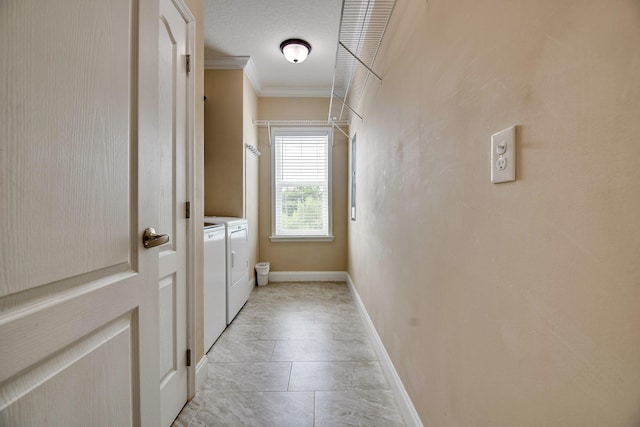 laundry area featuring crown molding and independent washer and dryer