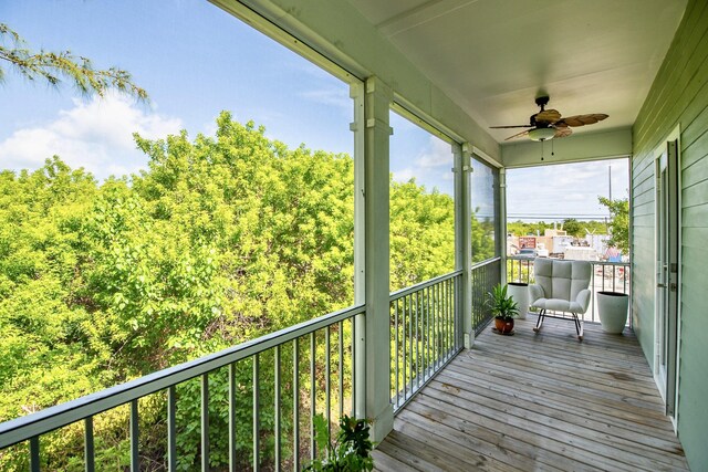 exterior space featuring ceiling fan