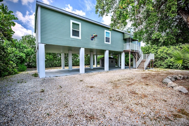 rear view of house with a carport