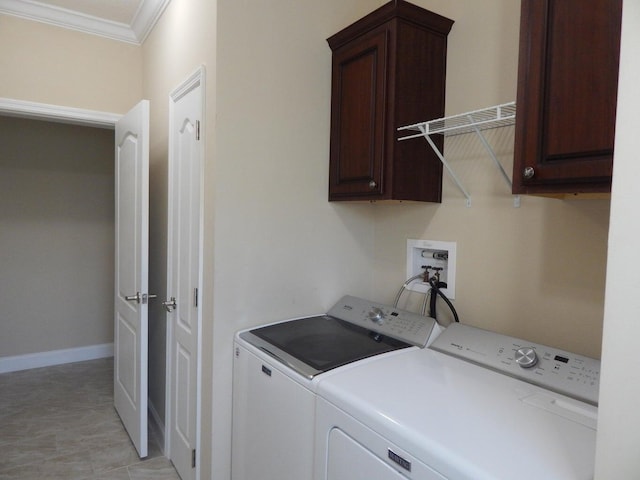 laundry area with cabinets, ornamental molding, and independent washer and dryer