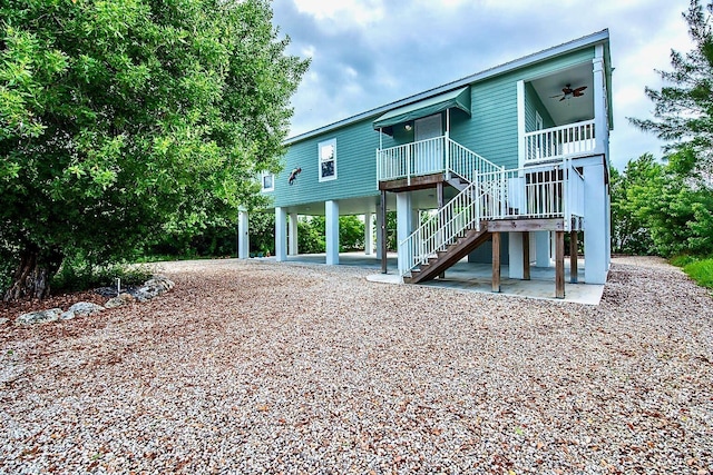 back of property featuring a patio and ceiling fan