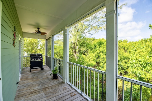 wooden deck featuring ceiling fan and grilling area