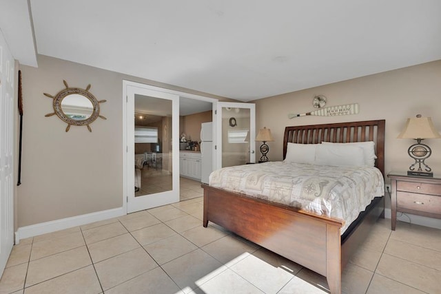 tiled bedroom with french doors and ensuite bathroom