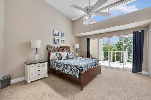 bedroom with ceiling fan, light colored carpet, access to exterior, and high vaulted ceiling