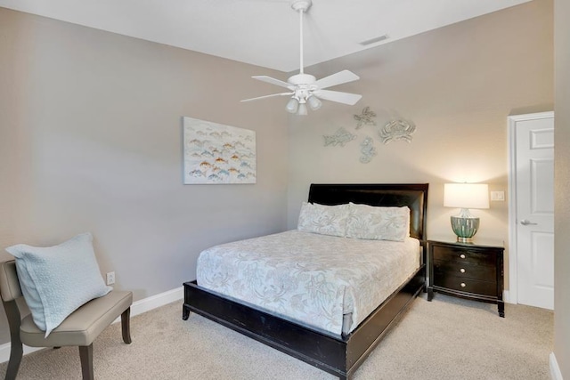 carpeted bedroom with lofted ceiling