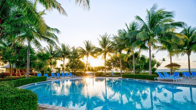 view of pool at dusk