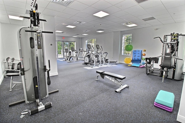 gym featuring a drop ceiling