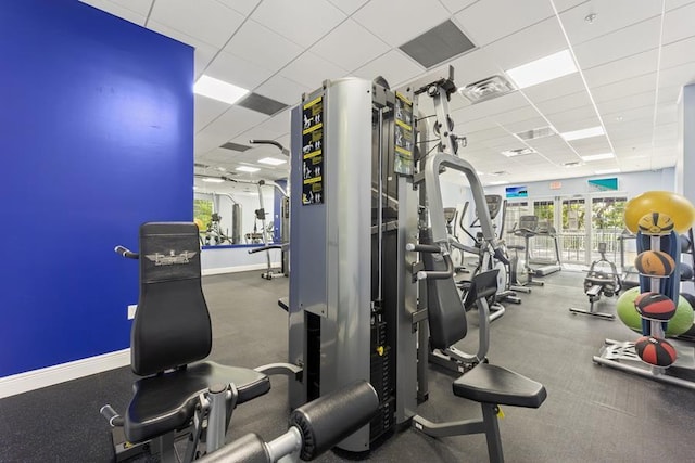 exercise room with a drop ceiling