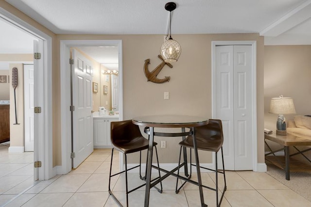 dining area featuring light tile patterned floors