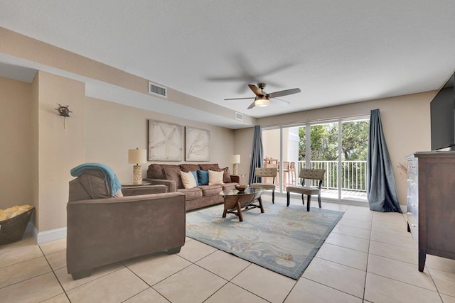 living room with light tile patterned floors and ceiling fan