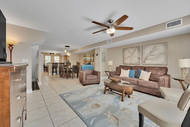 living room with light tile patterned flooring and ceiling fan