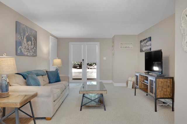 living room featuring light carpet and french doors