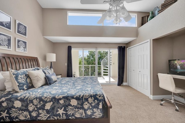 bedroom with light carpet, a towering ceiling, access to outside, and ceiling fan