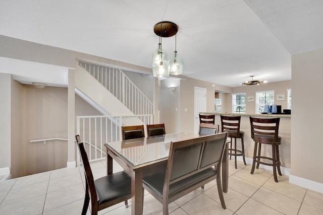 dining space with light tile patterned floors