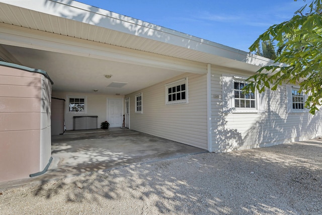 exterior space featuring a carport